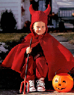 Little boy in a devil costume